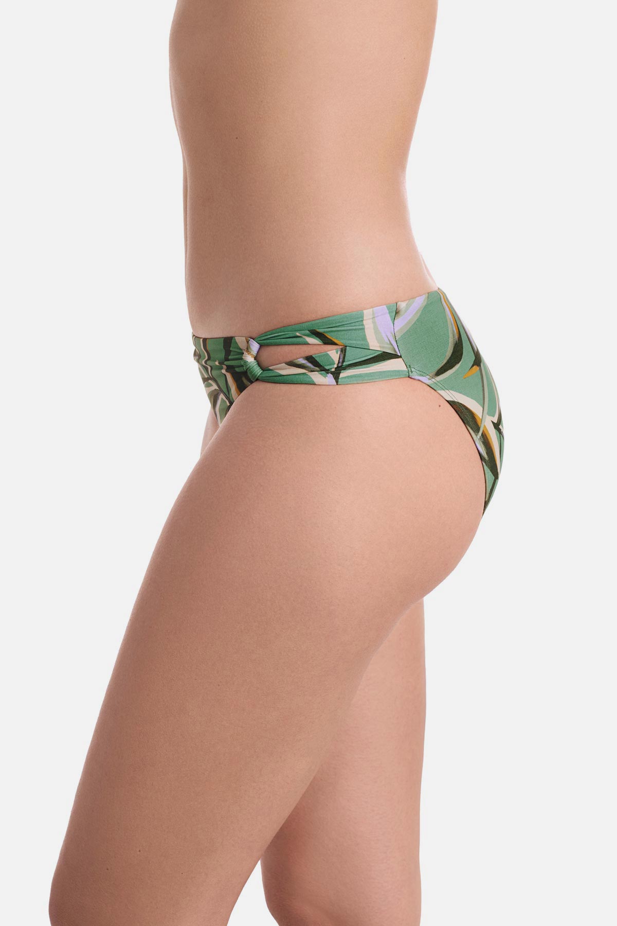 Side view of multicolored leaf printed swim bottoms with side cutouts 