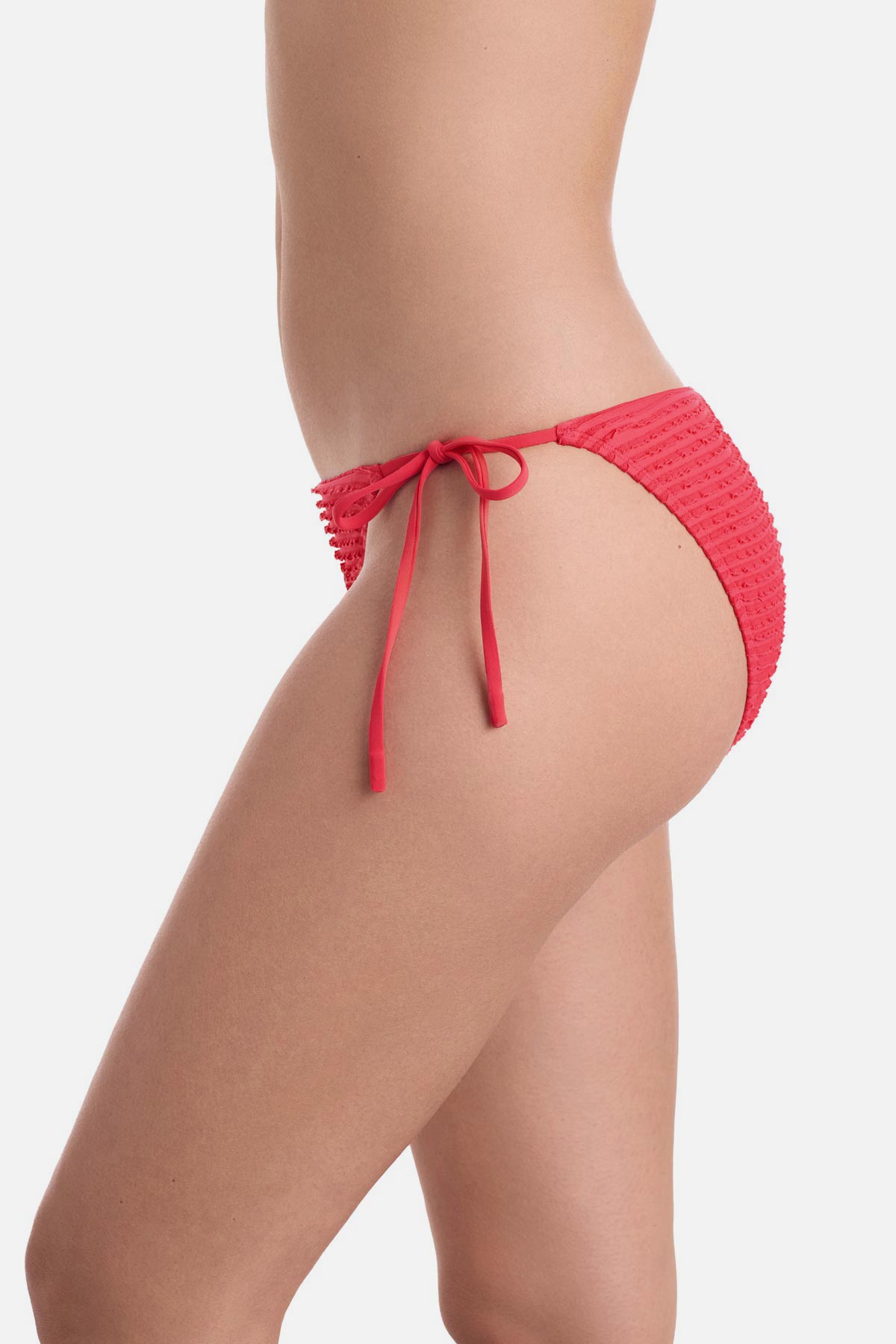 Side view of coral colored side tie swim bottoms