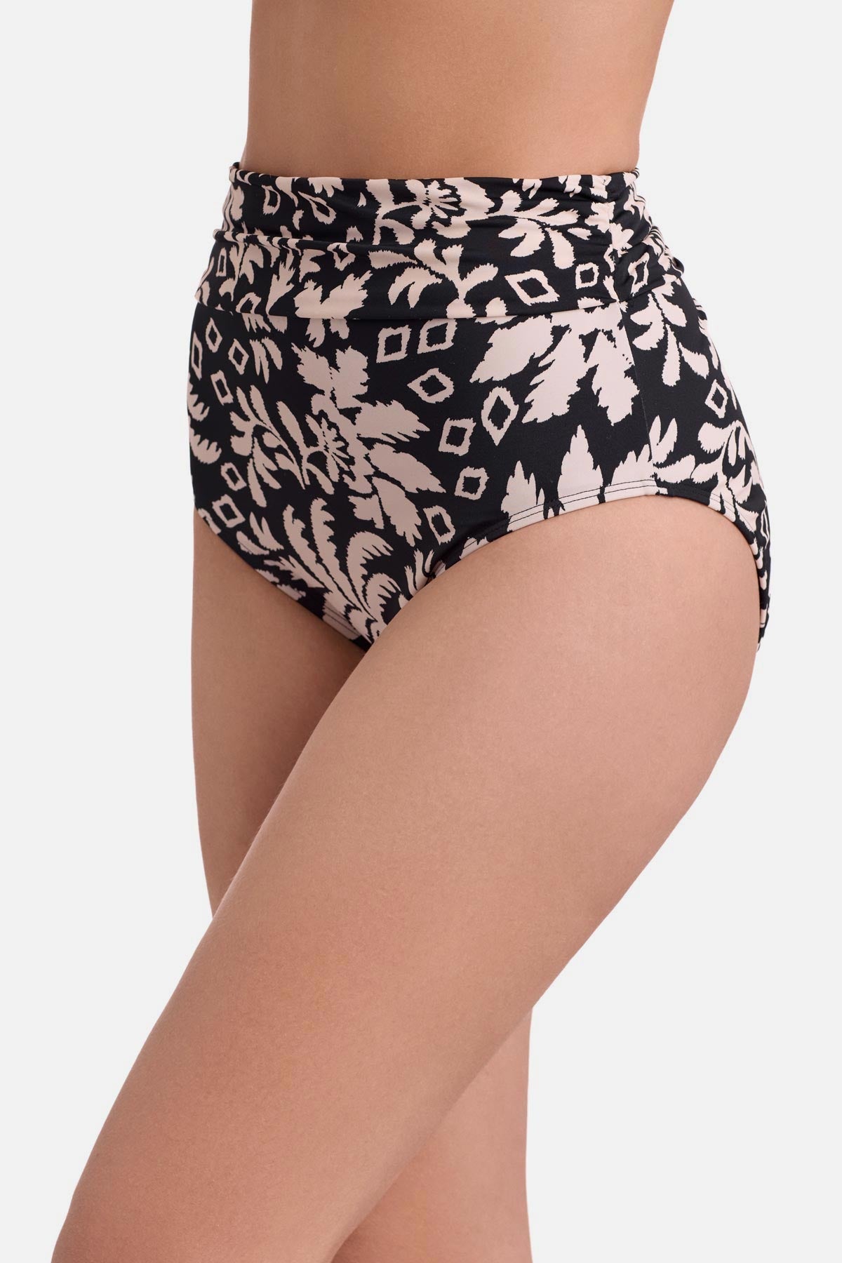Side view of black and white palm tree printed high waisted swim bottoms