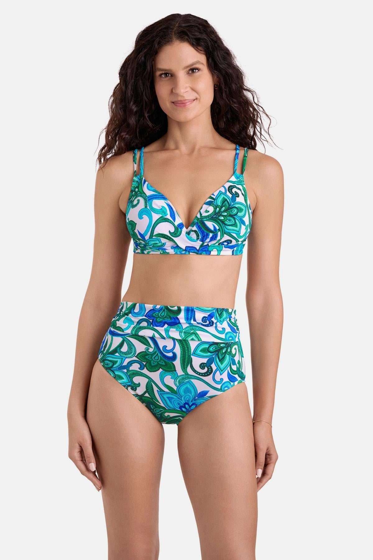 Woman wearing a blue and green floral printed bikini top with matching high waisted swim bottoms