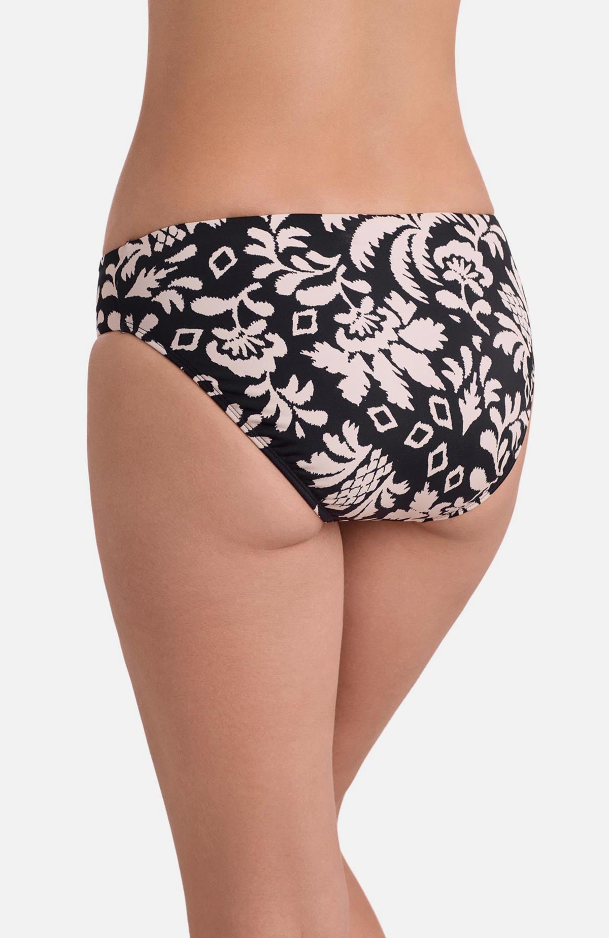 Back view of low rise black and white palm tree printed swim bottoms