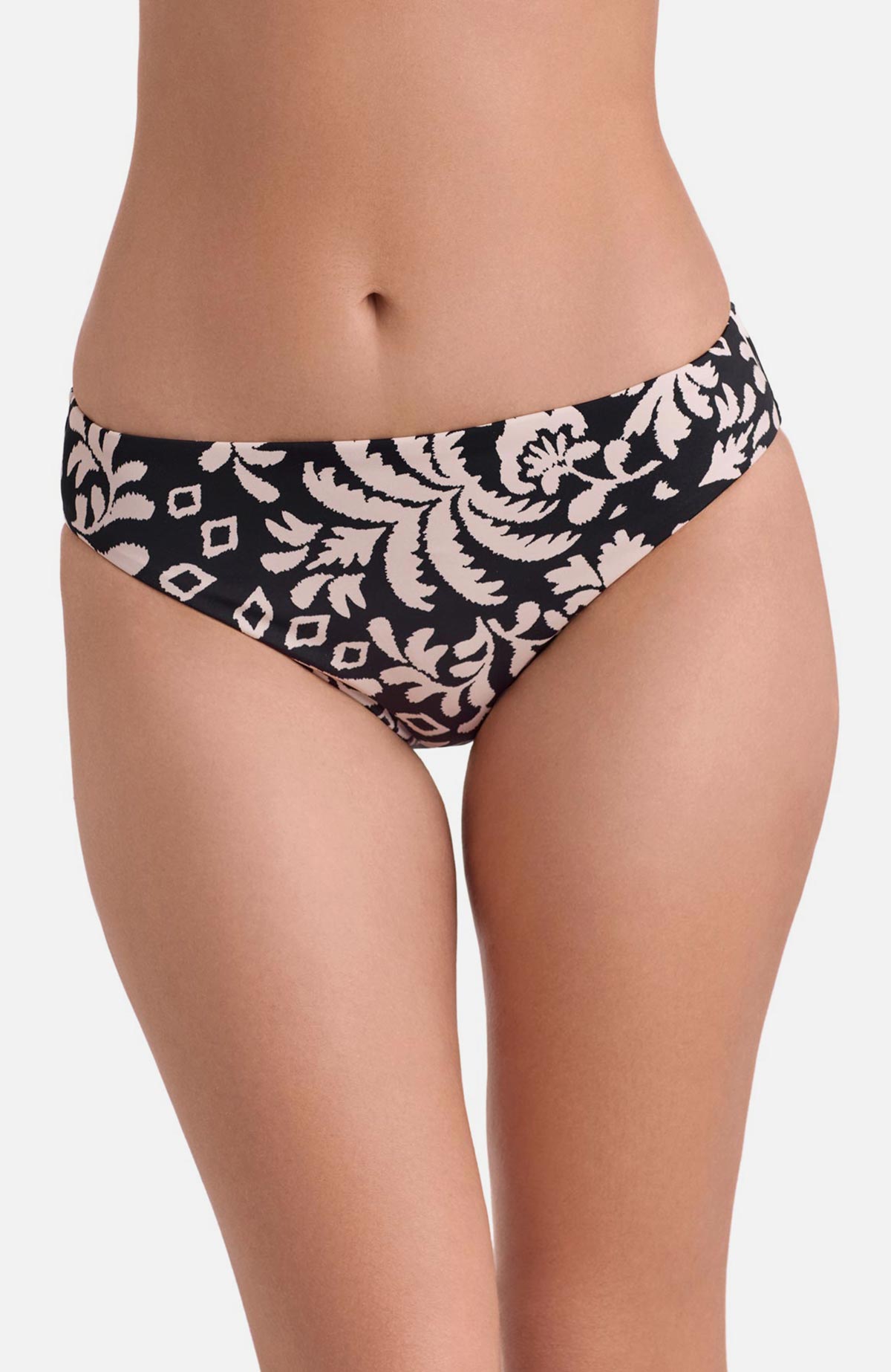 Front view of low rise black and white palm tree printed swim bottoms