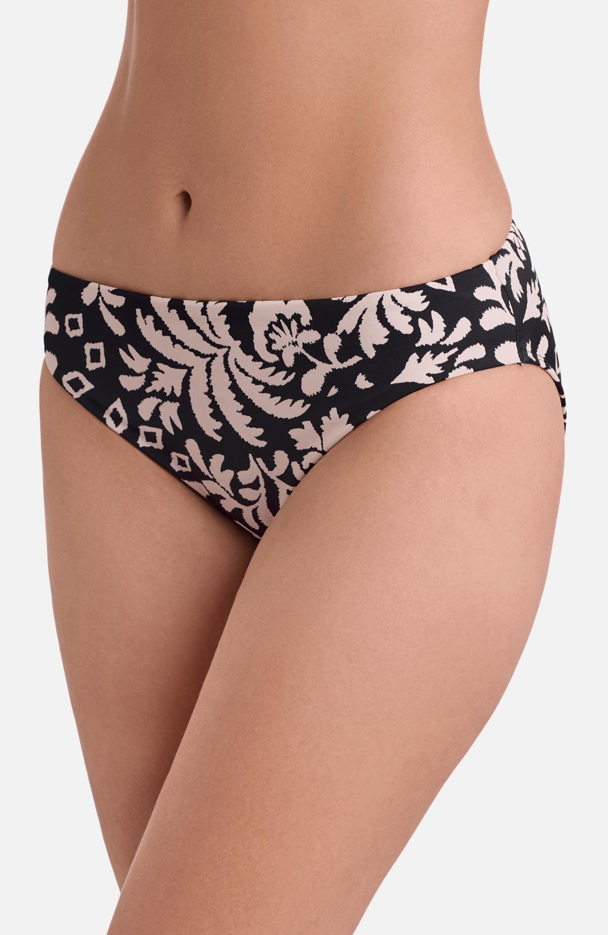 Side view of low rise black and white palm tree printed swim bottoms