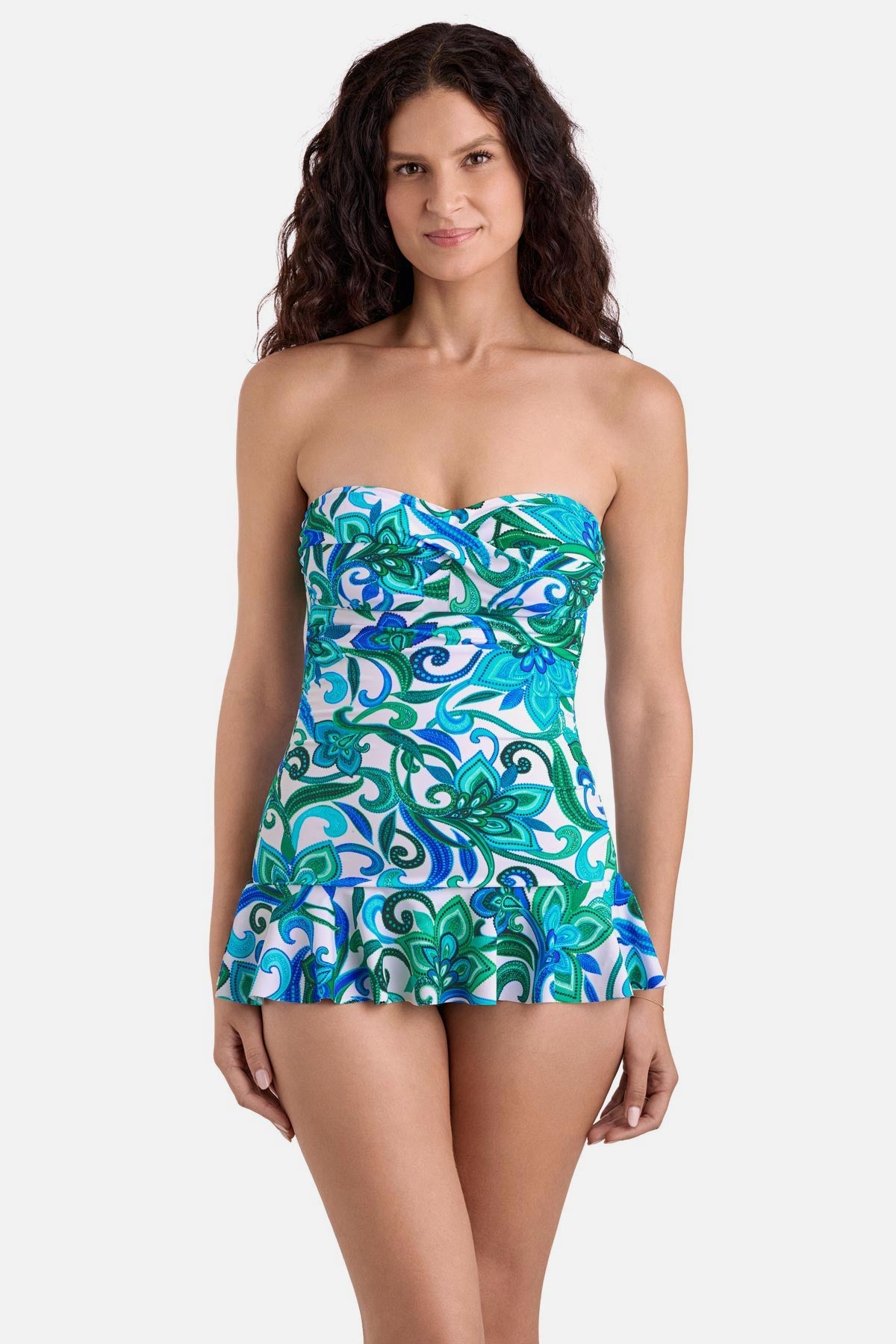 Woman wearing a blue and green floral printed skirted one-piece swimsuit