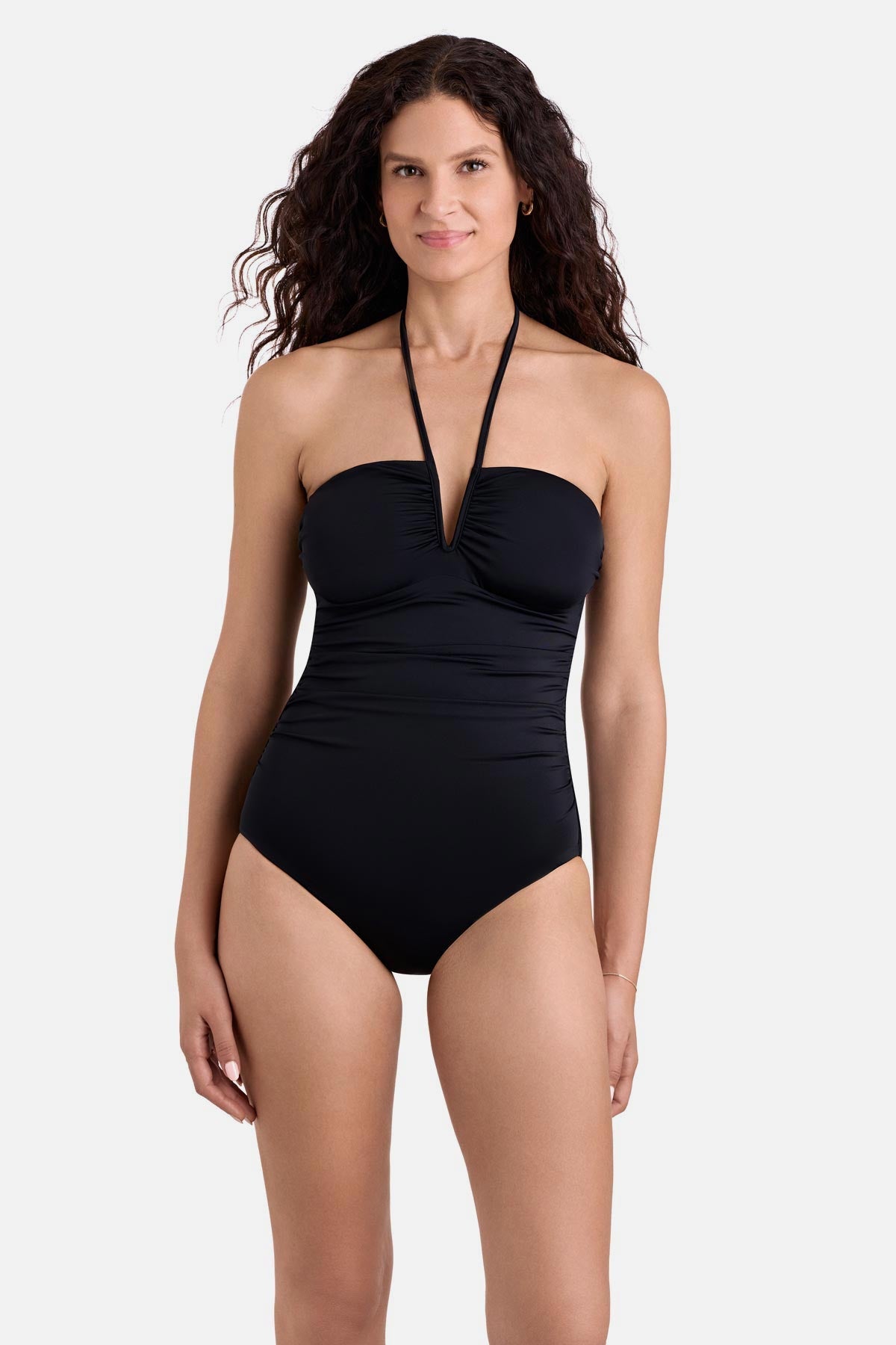 Woman wearing a black one-piece halter bandeau swimsuit